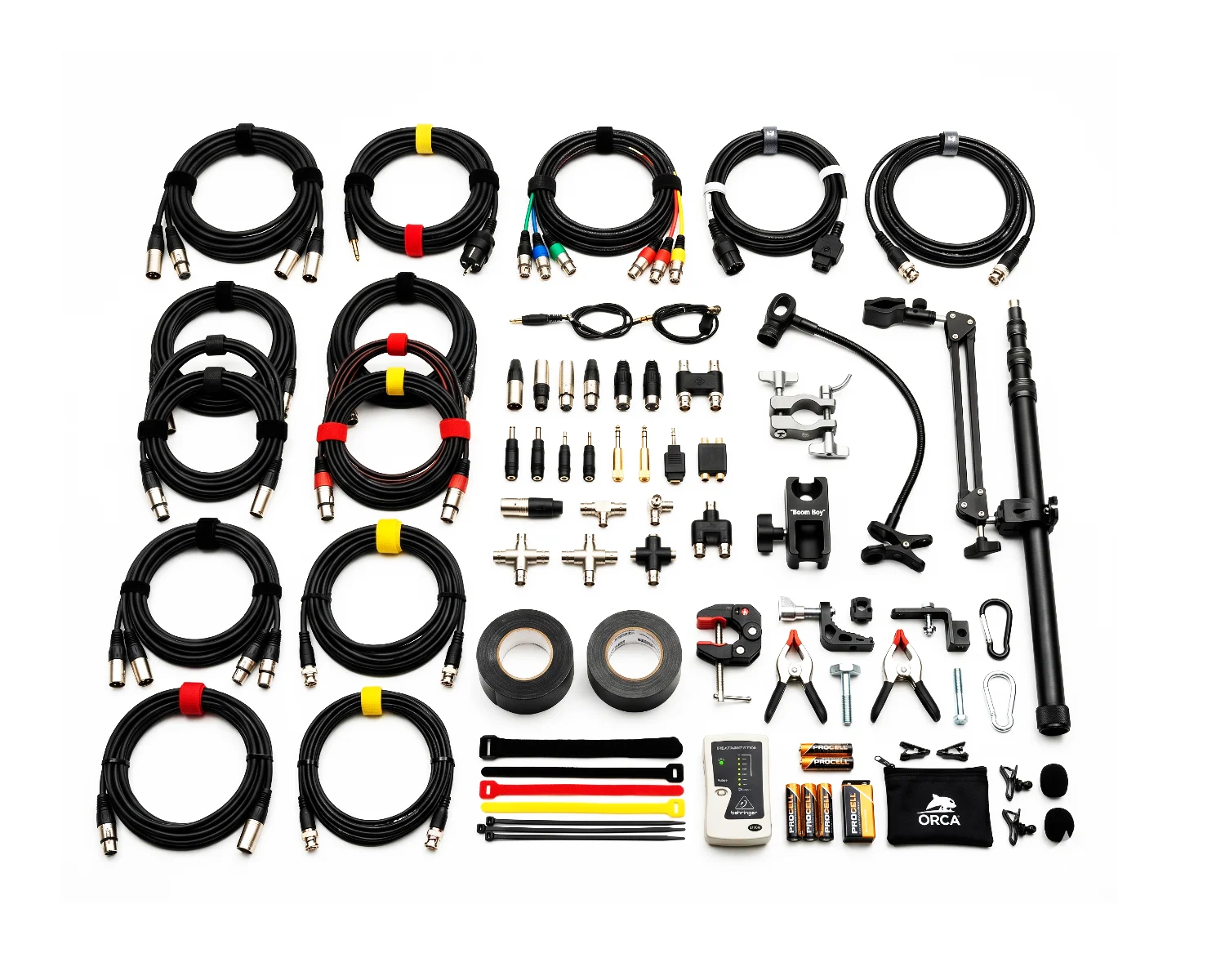 Composite image of professional production sound accessories including audio, power, and RF cables, adapters, boom holders, articulated arms, and rigging tools on a white background for rental in Italy.